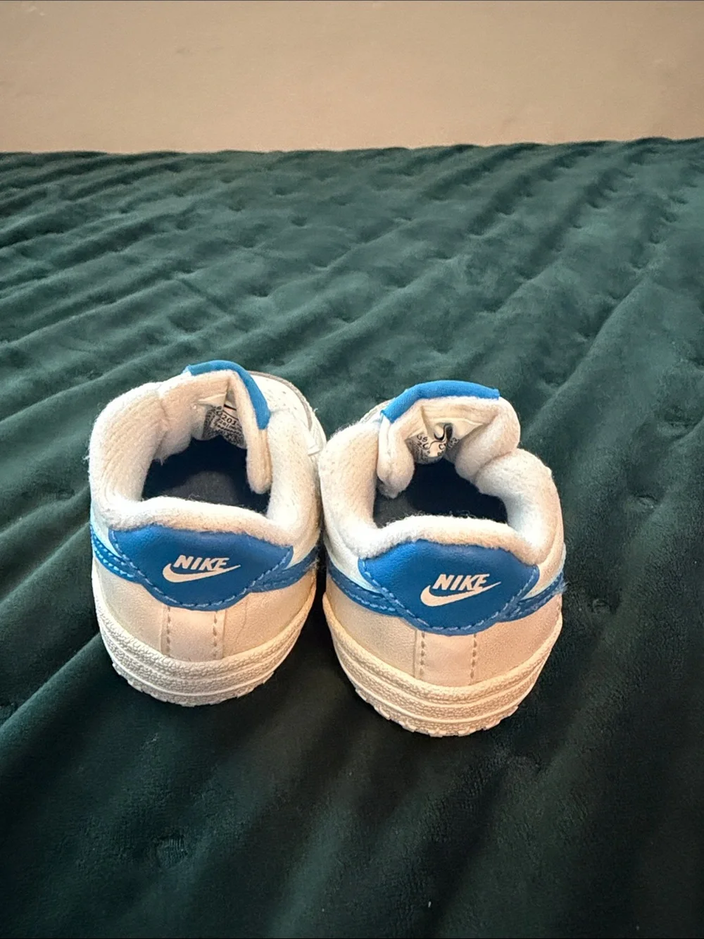 Nike Kids White Sneakers with Blue Logos